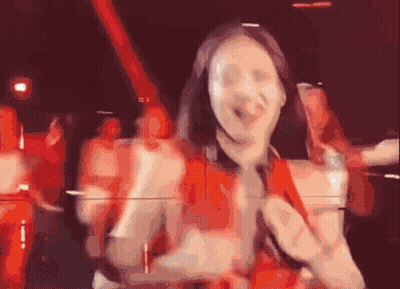 Woman In Red Dress Dancing With Microphone GIF