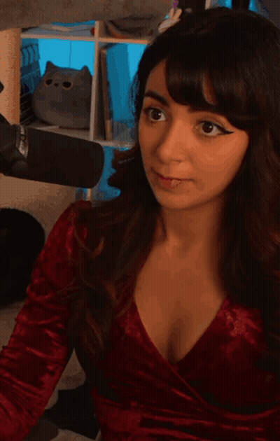 Woman In Red Dress Eating GIF