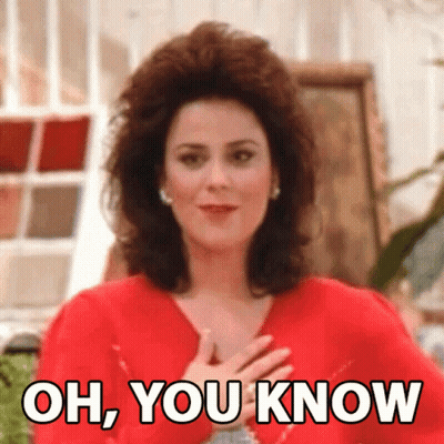 Woman In Red Dress Hands To Chest Saying Oh You Know GIF
