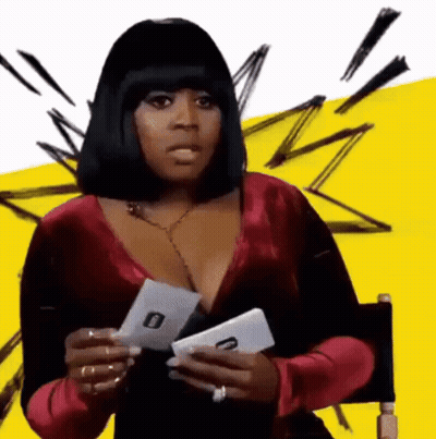 Woman In Red Dress Holding Card With O GIF