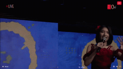 Woman In Red Dress Holding Microphone GIF