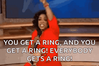 Woman In Red Dress Holding Microphone Saying You Get A Ring GIF
