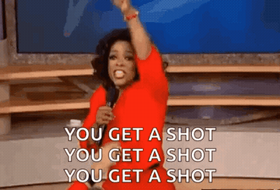 Woman In Red Dress Holding Microphone Saying You Get A Shot GIF