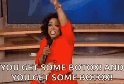 Woman In Red Dress Holding Microphone Saying You Get Some Botox And You Get Some Botox GIF