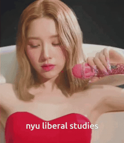 Woman In Red Dress Holding Pink Microphone NYU Liberal Studies GIF
