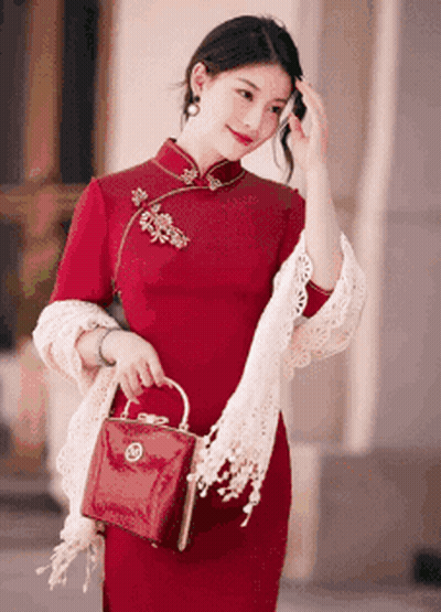 Woman In Red Dress Holding Red Bag GIF