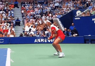 Woman In Red Dress Holding Tennis Racquet GIF