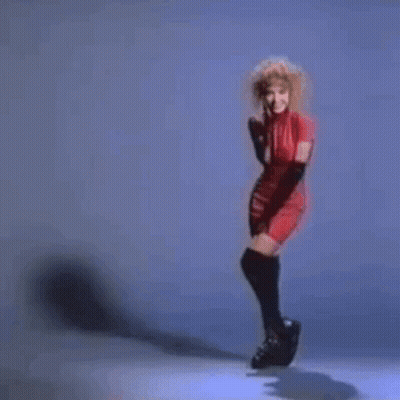 Woman In Red Dress Ice Skating GIF