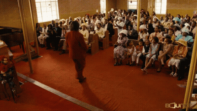 Woman In Red Dress In Church Saying Bounty GIF