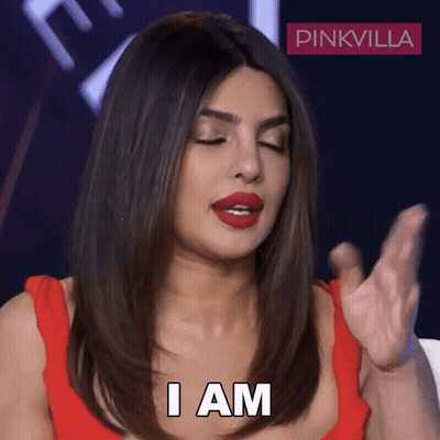 Woman In Red Dress In Front Of Pinkvilla Logo GIF