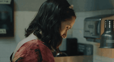 Woman In Red Dress In Front Of Toaster GIF