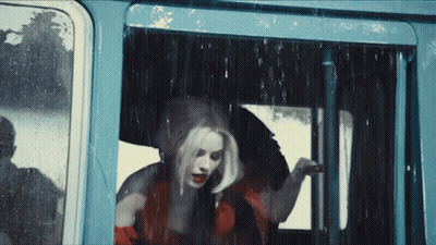 Woman In Red Dress Looking Out Window GIF