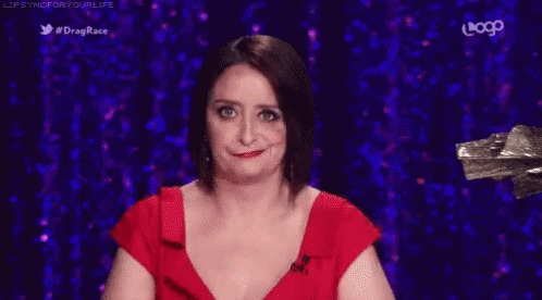 Woman In Red Dress Making Funny Face GIF