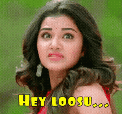 Woman In Red Dress Making Funny Face Saying Hey Loosu GIF