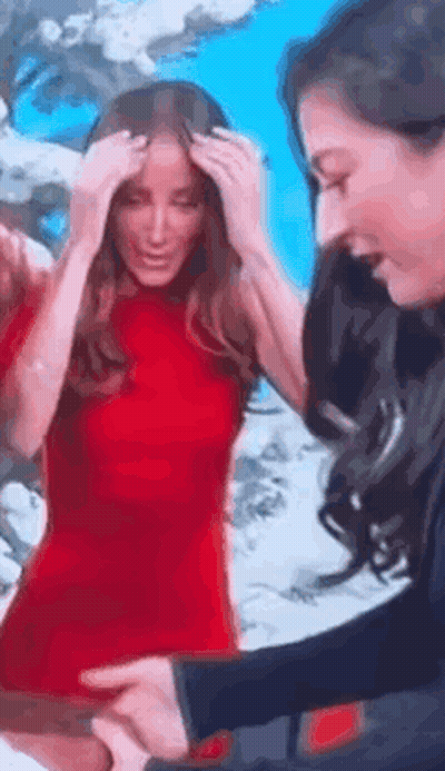 Woman In Red Dress Next To Woman In Black Shirt GIF