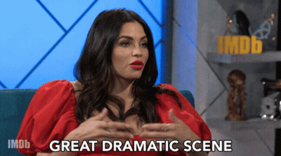 Woman In Red Dress On Blue Couch Saying Great Dramatic Scene GIF