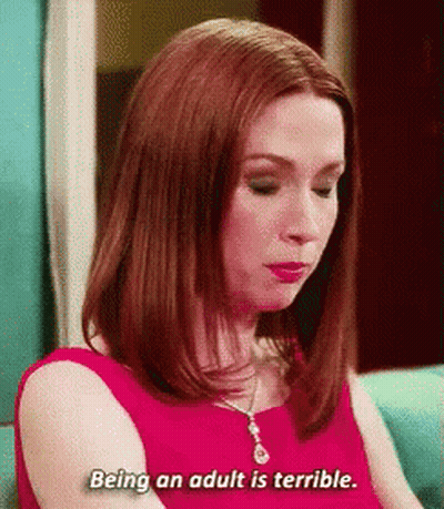 Woman In Red Dress On Blue Couch Says Being An Adult Is Terrible GIF