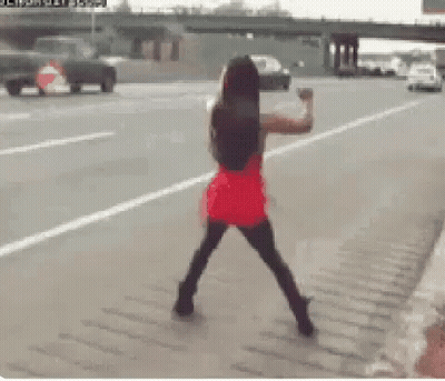 Woman In Red Dress On Roadside GIF