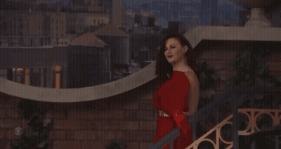 Woman In Red Dress On Stairs GIF
