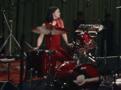 Woman in Red Dress Playing Ludwig Drums