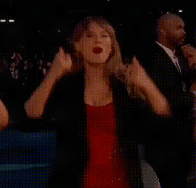 Woman In Red Dress Raising Fist GIF