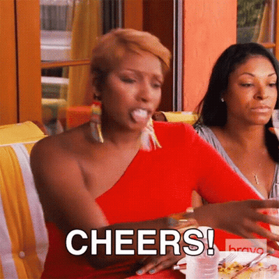 Woman In Red Dress Saying Cheers With Plate And Glass GIF