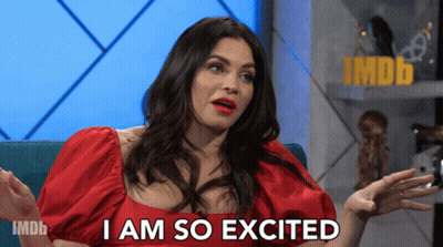 Woman In Red Dress Saying I Am So Excited Imdb Logo GIF