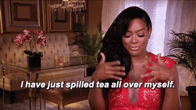 Woman In Red Dress Saying I Just Spilled Tea All Over Myself GIF