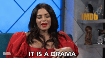 Woman In Red Dress Saying It's A Drama On IMDb GIF