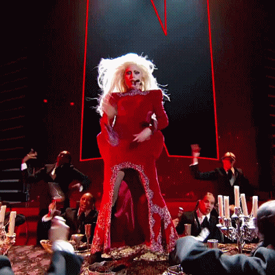Woman In Red Dress Singing Into Microphone GIF