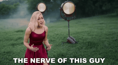 Woman In Red Dress Singing The Nerve Of This Guy GIF