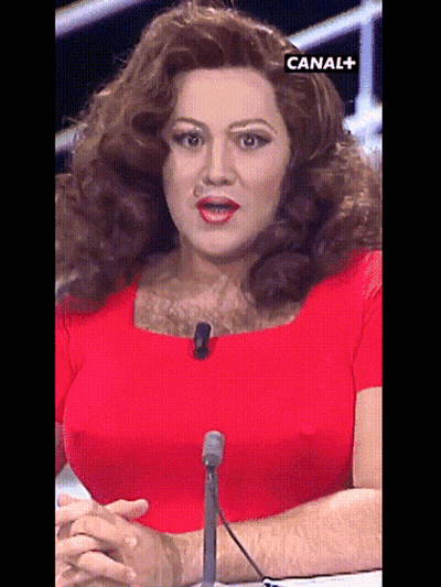 Woman In Red Dress Sitting At Microphone Canal + GIF