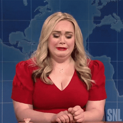 Woman In Red Dress Sitting At Table With Map GIF
