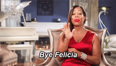 Woman In Red Dress Sitting In Living Room GIF