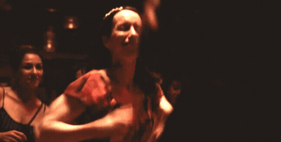 Woman In Red Dress Smiling And Dancing GIF