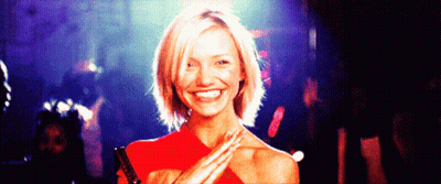 Woman In Red Dress Smiling Hands On Shoulders GIF