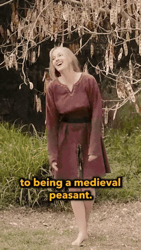 Woman In Red Dress Standing Before Tree Saying To Being A Medieval Peasant GIF