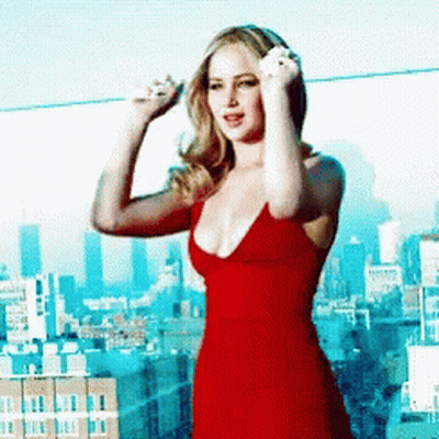 Woman In Red Dress Standing In Front Of City GIF