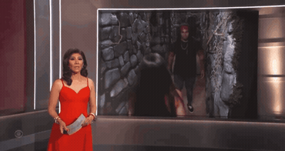 Woman In Red Dress Standing In Front Of Picture GIF