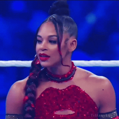 Woman In Red Dress Standing In Ring GIF