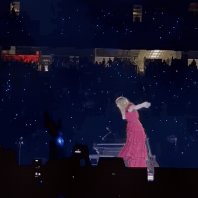 Woman In Red Dress Standing On Stage With Guitar GIF