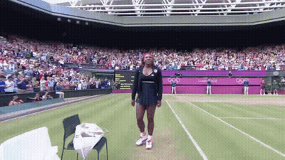 Woman In Red Dress Swinging Tennis Racquet GIF