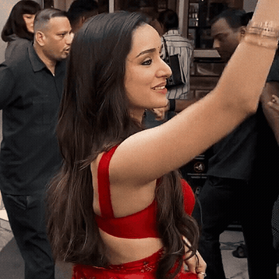 Woman In Red Dress Taking Selfie GIF
