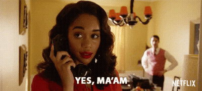 Woman In Red Dress Talking On Phone GIF