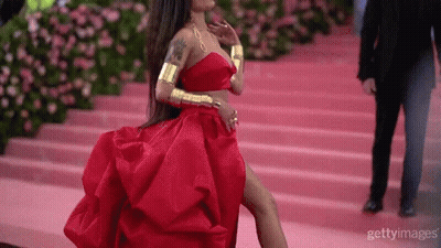 Woman In Red Dress Walking Down Pink Staircase GIF