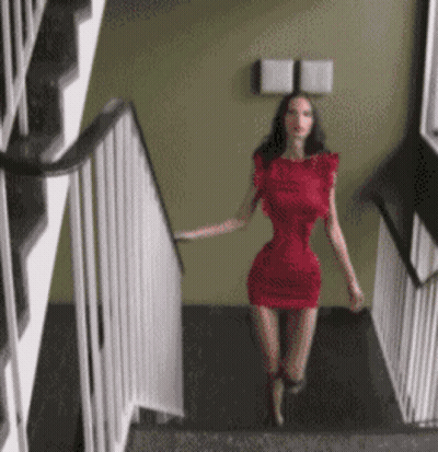 Woman In Red Dress Walking Down Stairs GIF