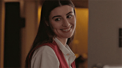 Woman In Red Dress Walking Down Stairs GIF
