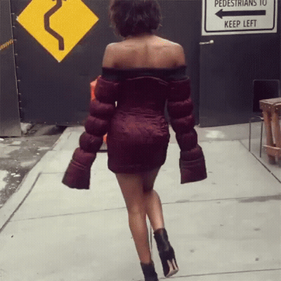 Woman In Red Dress Walking Past Pedestrians Keep Left Sign GIF