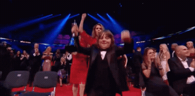 Woman in Red Dress Walking Red Carpet