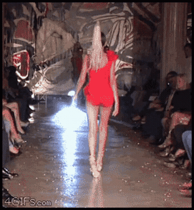 Woman In Red Dress Walking Runway GIF